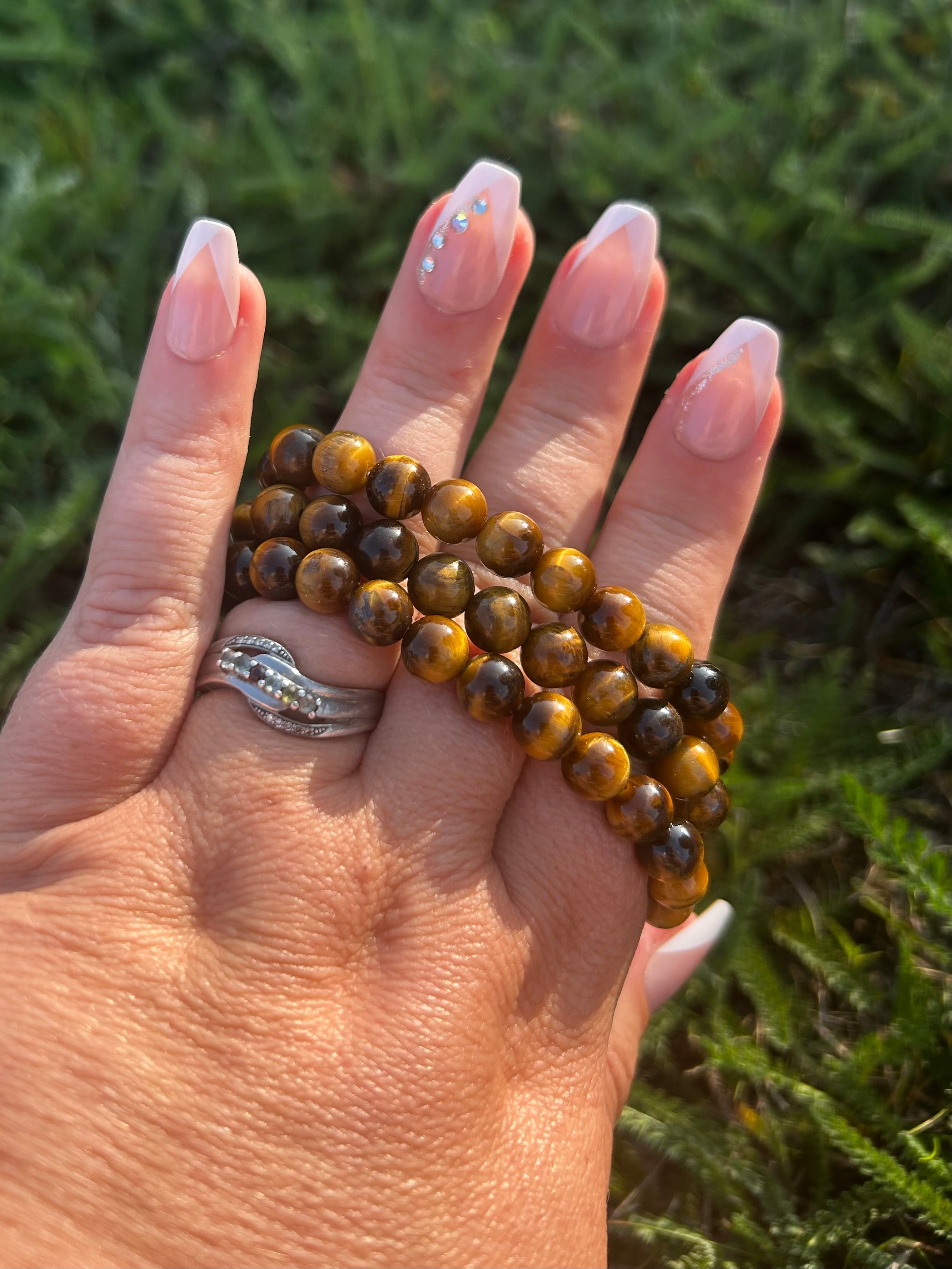 Close-up of polished Tiger Eye beads showing natural chatoyancy