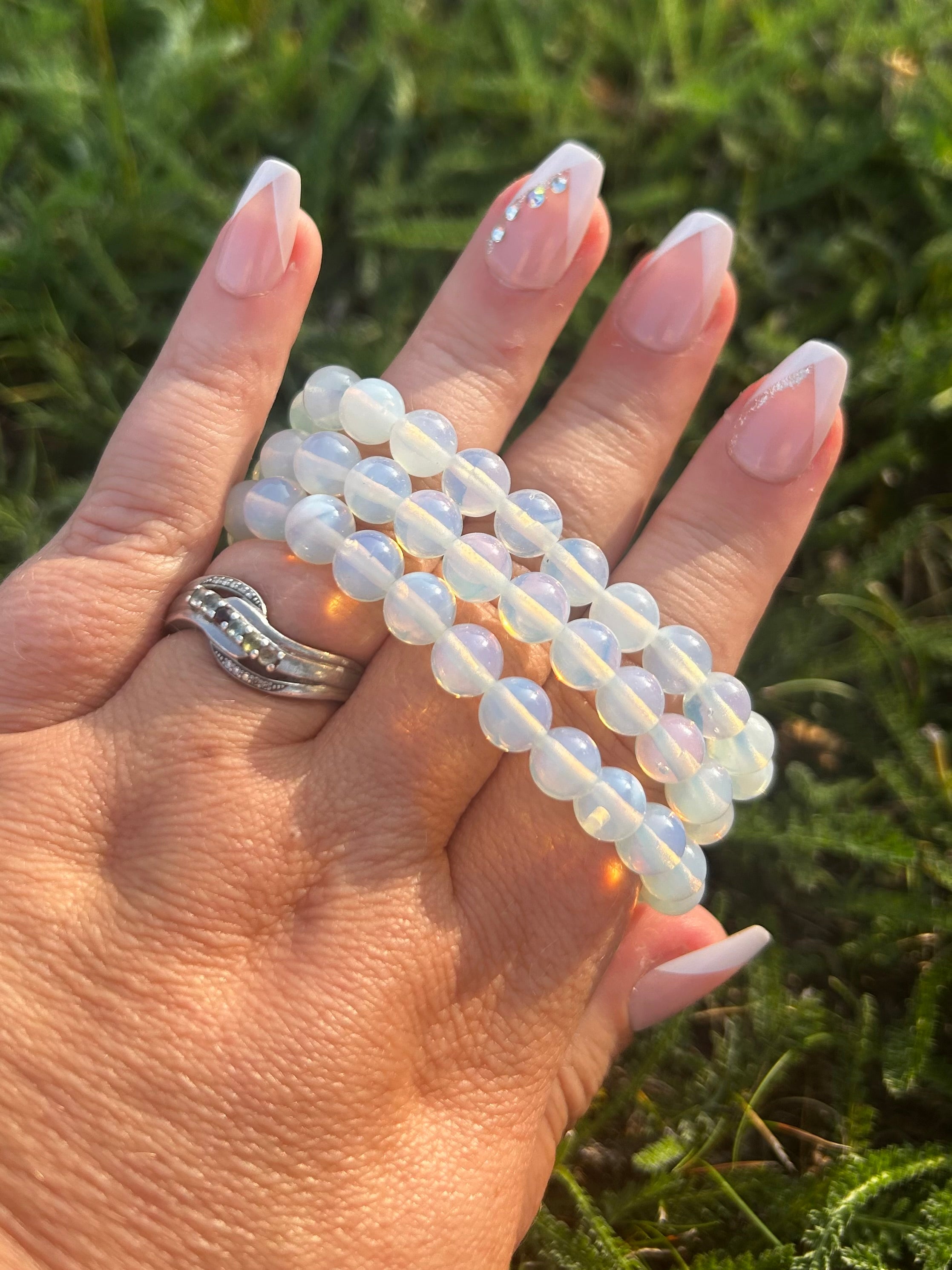 Man-made Opalite gemstone bracelet with blue pink and golden iridescence