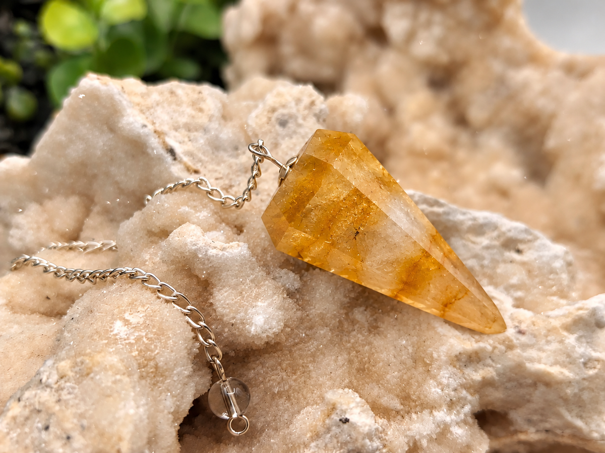 Golden Healer Quartz crystal pendulum with silver-plated chain for divination and energy work