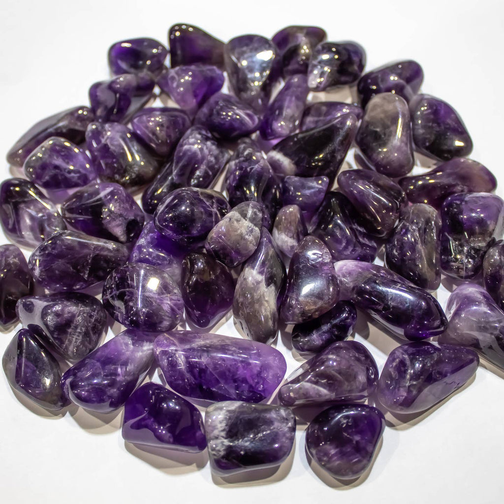 Polished purple Amethyst tumbled stones with natural color variations