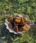 Yellow Tiger Eye tumbled stone with golden and honey brown coloring