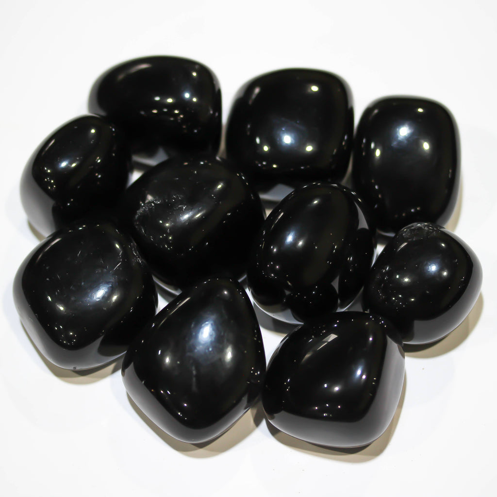 Close-up of polished Black Obsidian tumbled stone