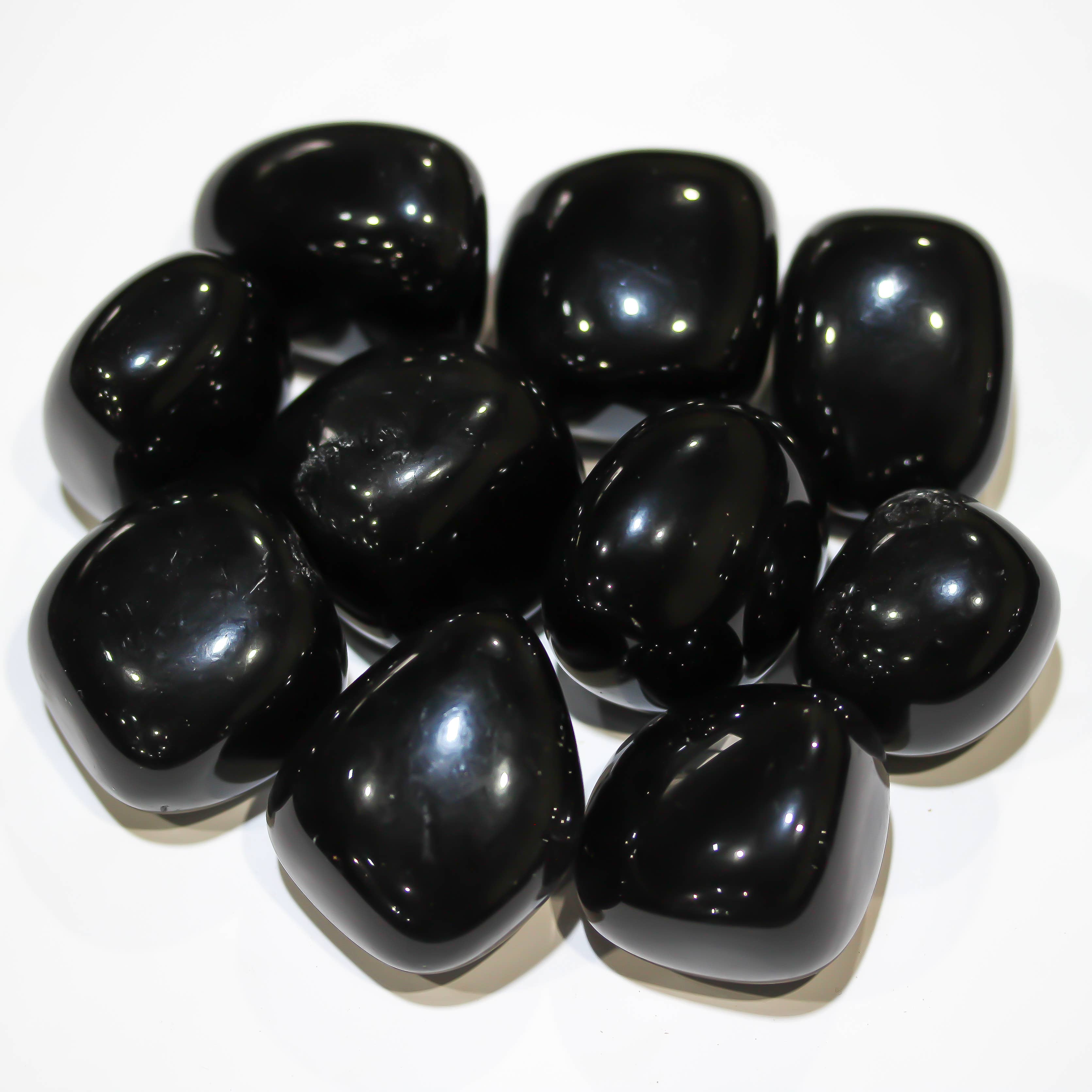 Close-up of polished Black Obsidian tumbled stone