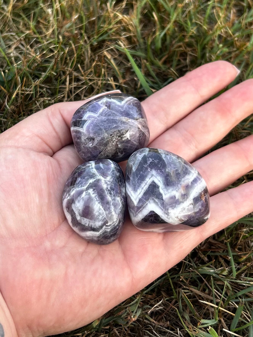 Close-up of Large Chevron Amethyst tumbled stone showing natural banding