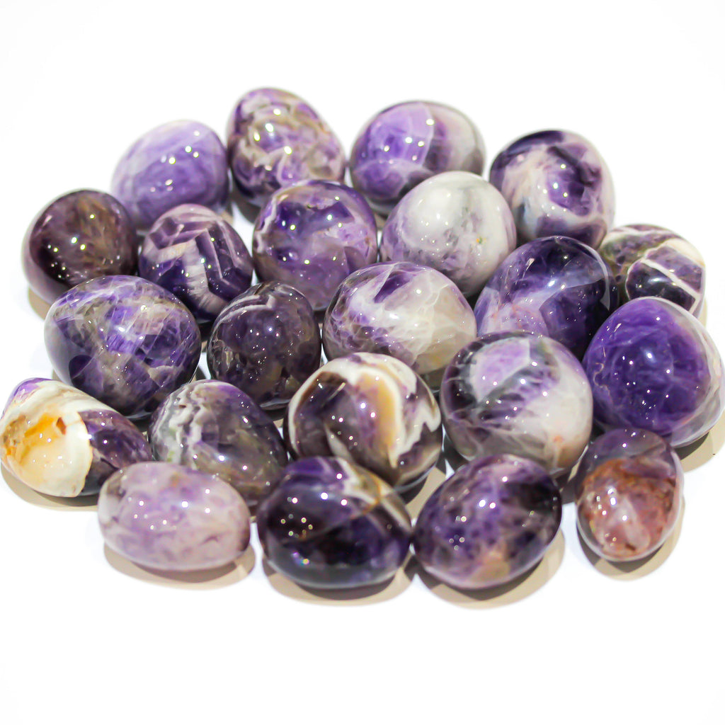 Large polished Chevron Amethyst tumbled stones with natural purple and white banded patterns.

