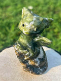 The Dreamer nephrite jade dragon carving in a relaxed seated pose
