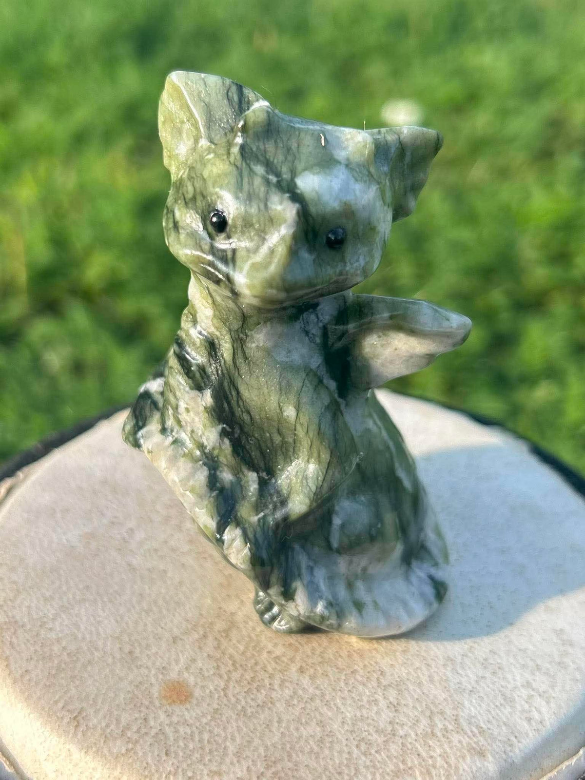 Close-up of The Guardian natural nephrite jade crystal dragon carving


