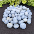 a pile of smooth polished angelite tumbles for connecting with your guides and meditation