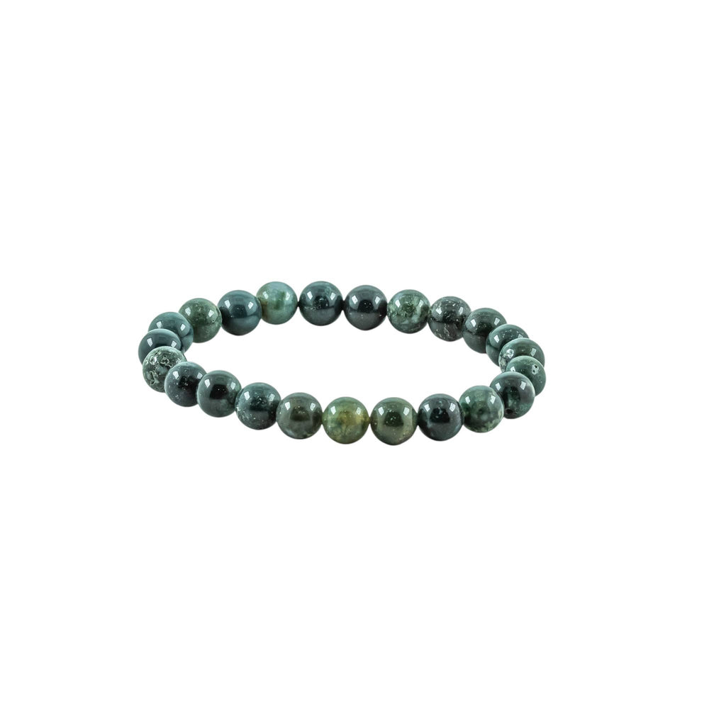 Close-up of polished Moss Agate beads with natural branch-like inclusions