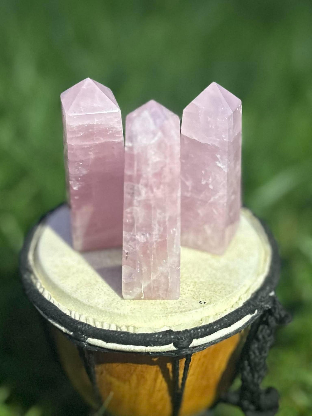 Close-up of polished Rose Quartz crystal towers with soft pink color and natural internal patterns
