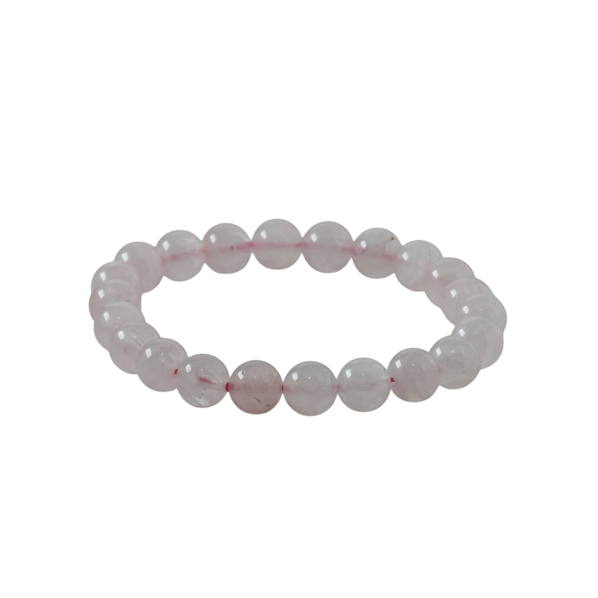 Close-up of polished Rose Quartz beads on an elastic stretch bracelet