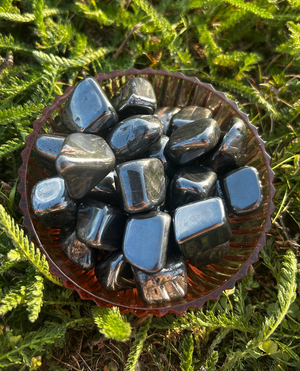 Hematite tumbled stone with polished metallic gray finish