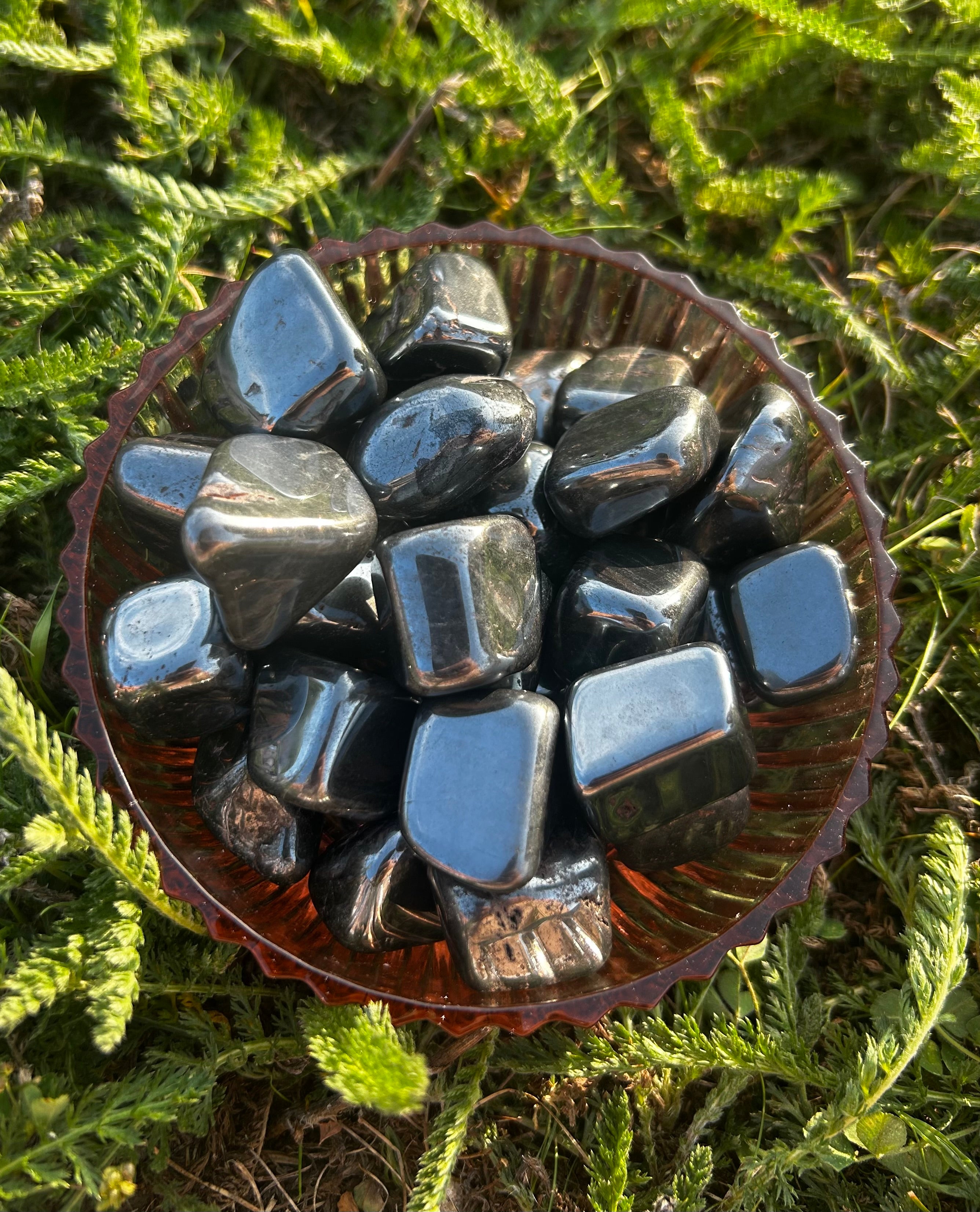 Hematite tumbled stone with polished metallic gray finish