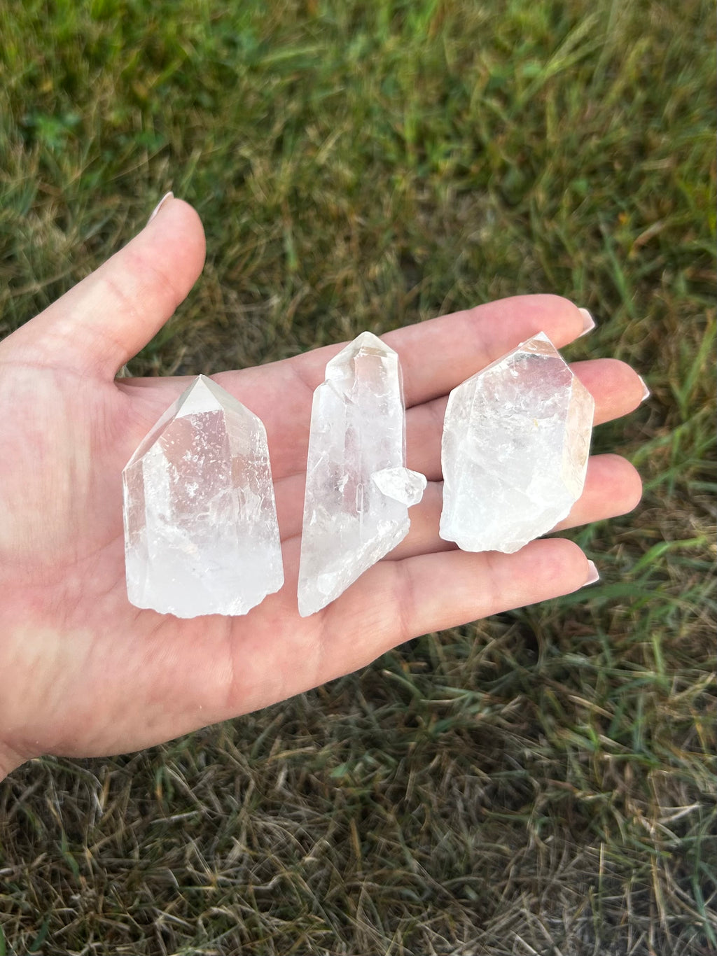 Clear Quartz raw crystal point showing natural inclusions and formations