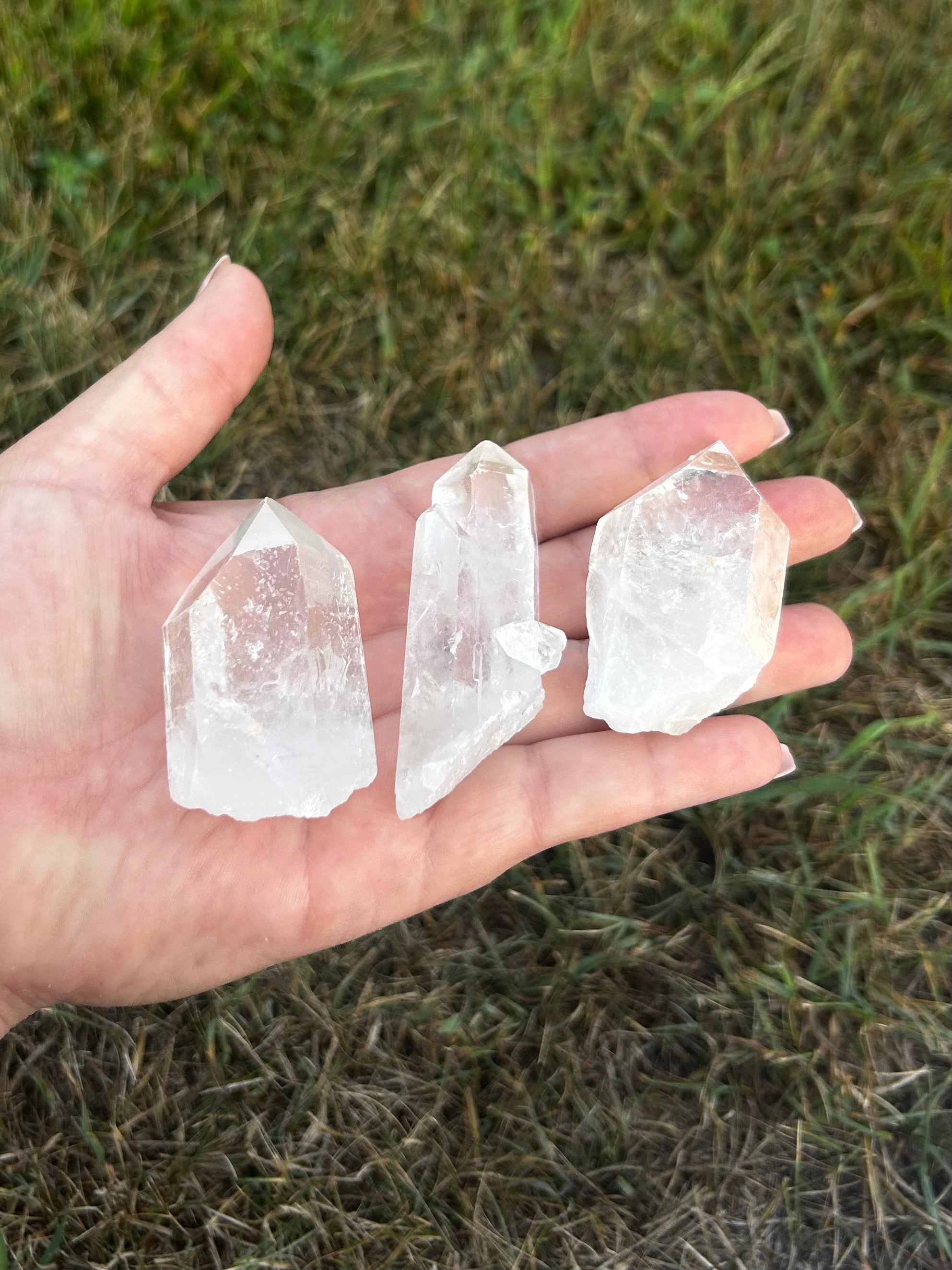 Clear Quartz raw crystal point showing natural inclusions and formations