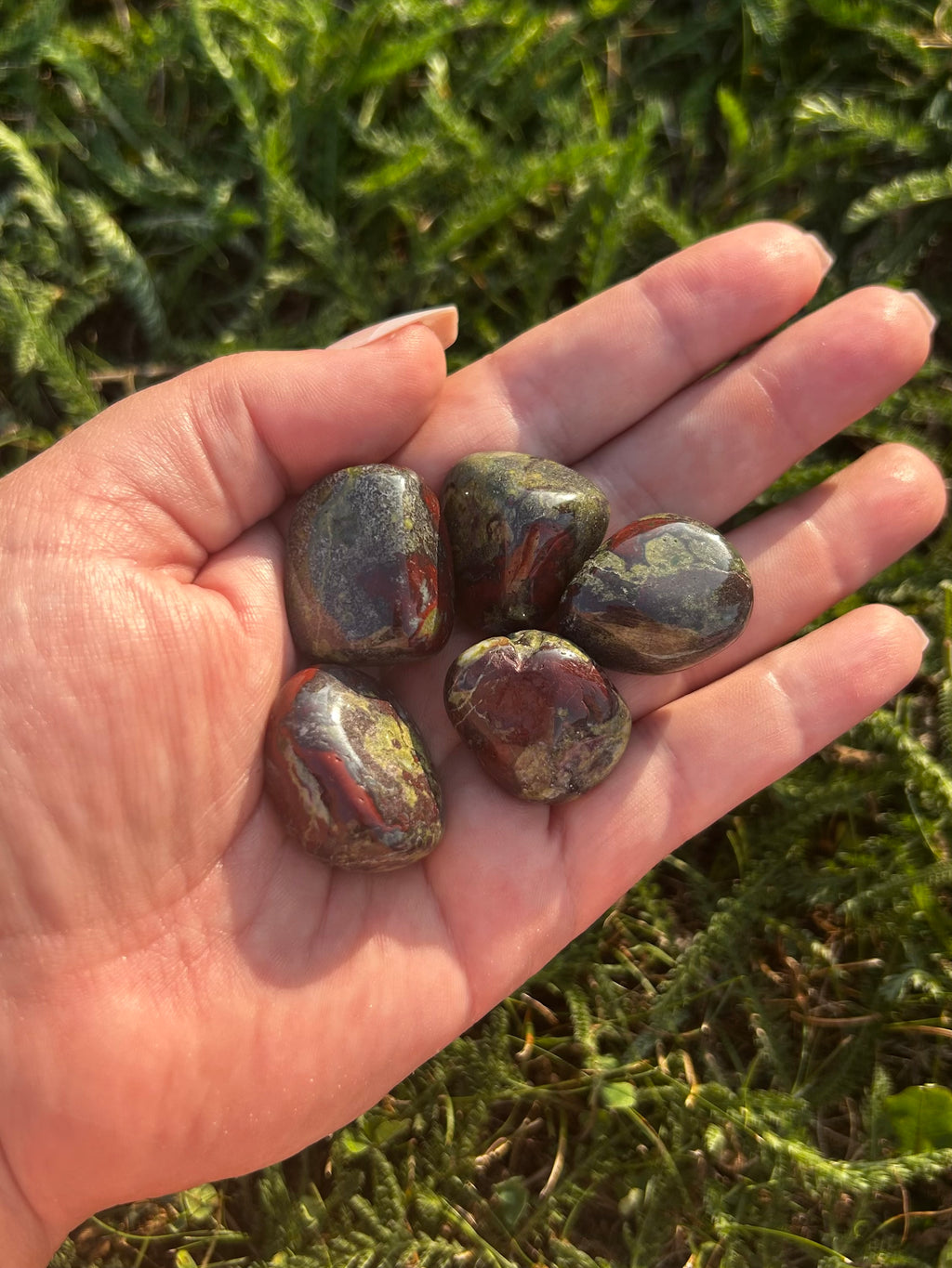 Dragon Bloodstone crystal with deep green coloring and contrasting red formations