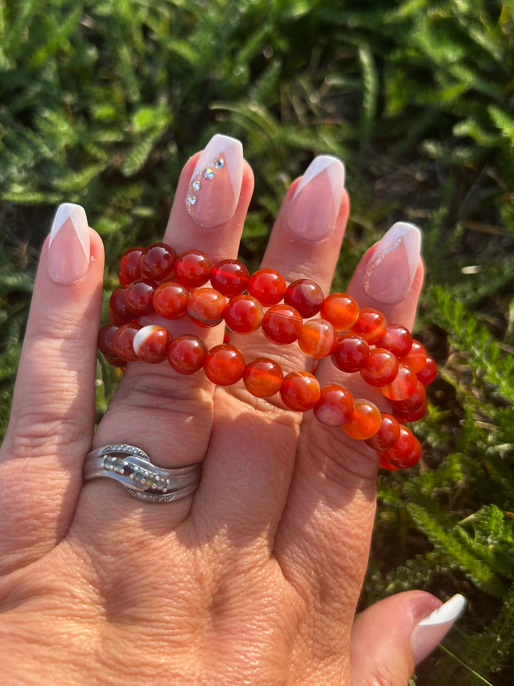 Natural Banded Carnelian gemstone bracelet with layered orange, rust, and amber patterns