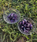 Natural Amethyst tumbled stone with polished purple surface