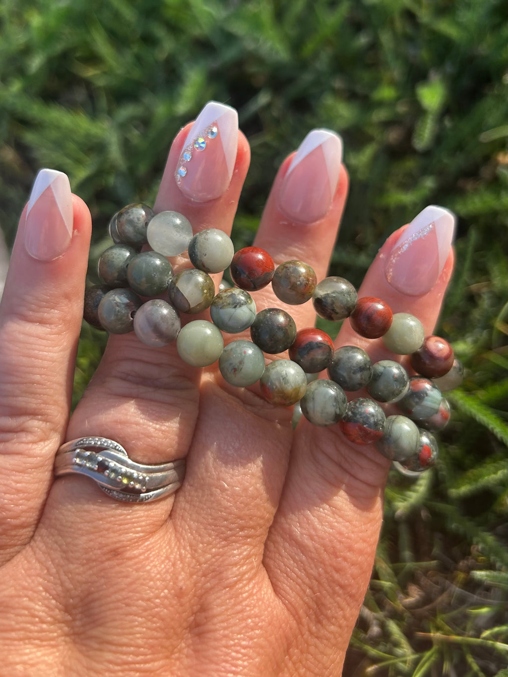 Close-up of polished Bloodstone beads showing natural red inclusions