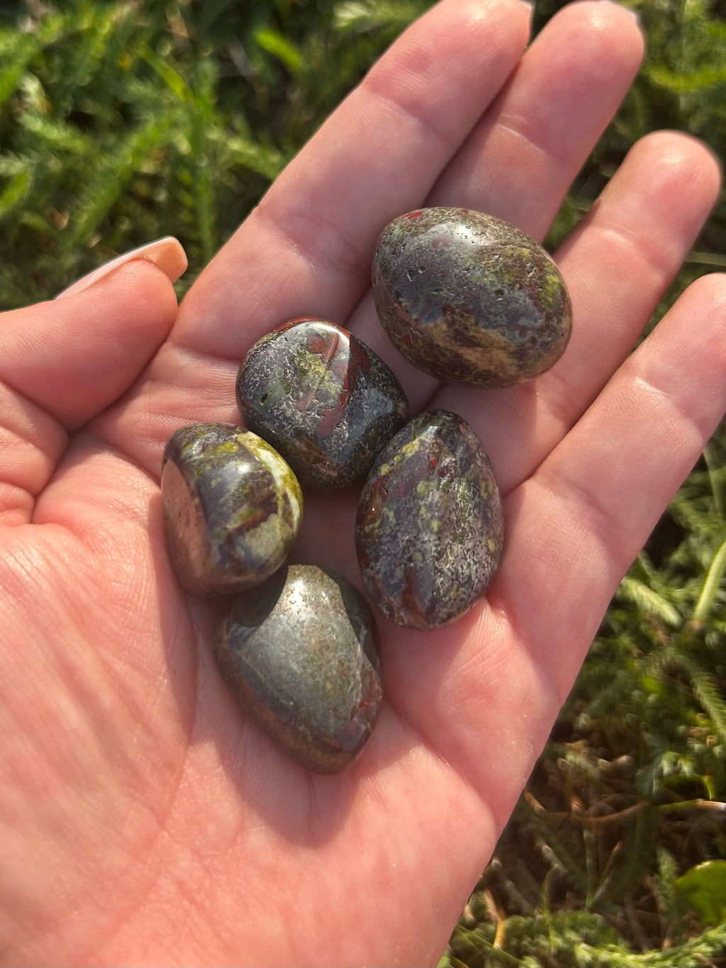 Close-up of Dragon Bloodstone tumbled stone showing unique natural patterns