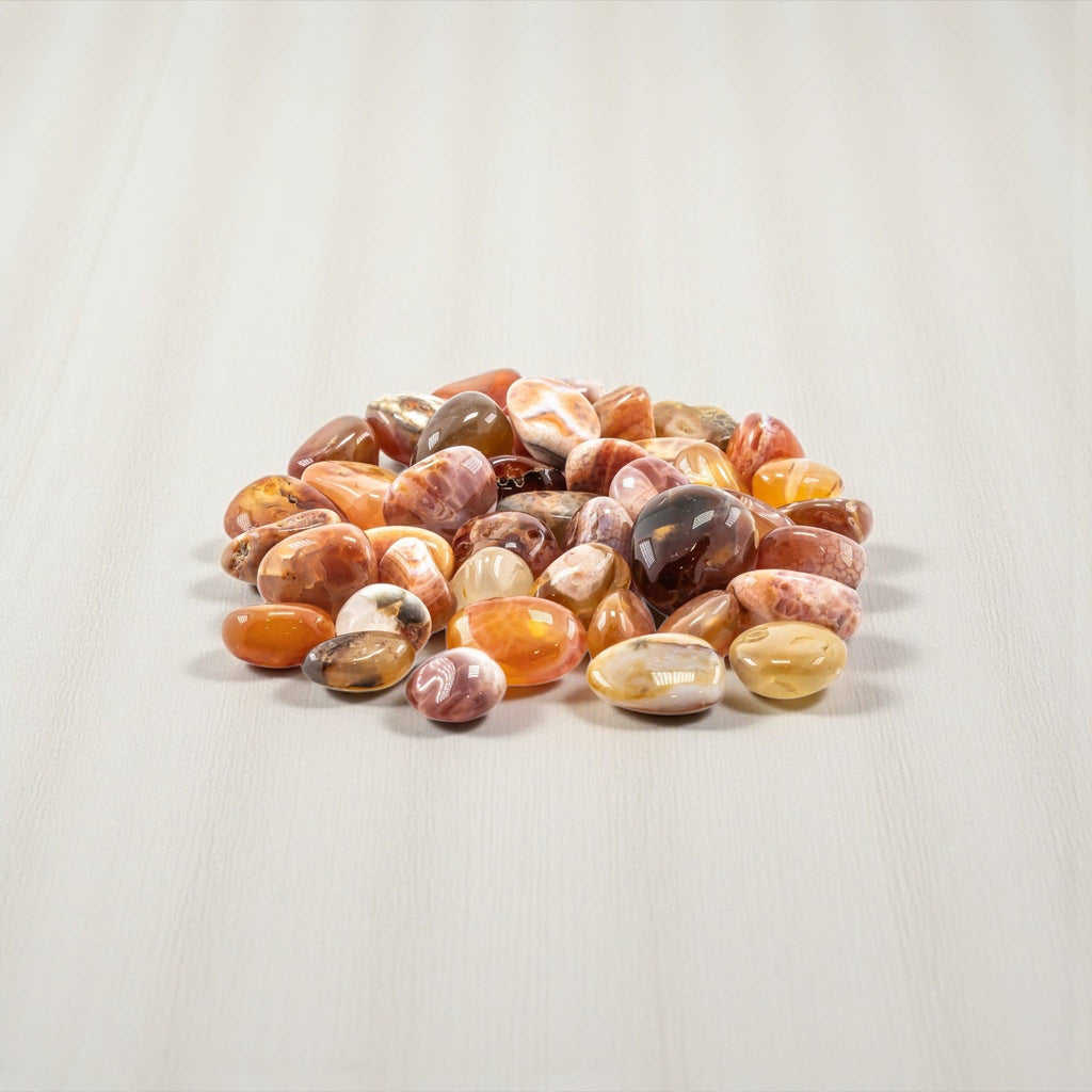 Natural Fire Agate tumbled stone with polished red, orange, and brown tones