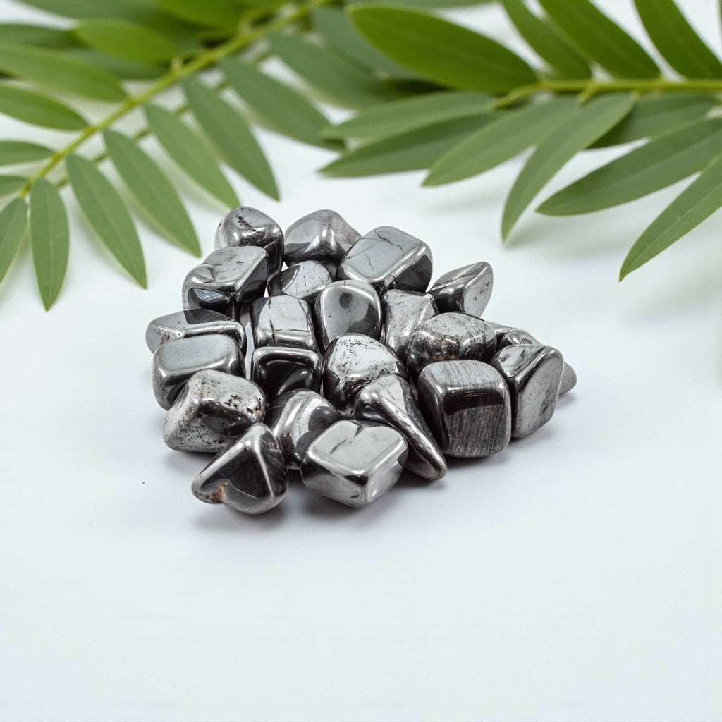 Natural hematite crystal tumbles with polished metallic gray finish