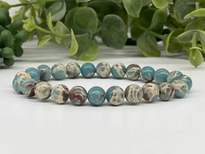 Close-up of polished Snake Skin Jasper beads showing intricate natural patterns