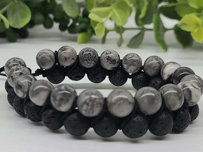 Close-up of natural Map Jasper and Lava Stone beads showing unique textures and patterns