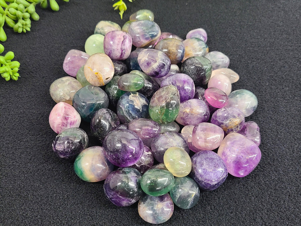 Rainbow Fluorite tumbled stone with purple, green, and blue color zoning