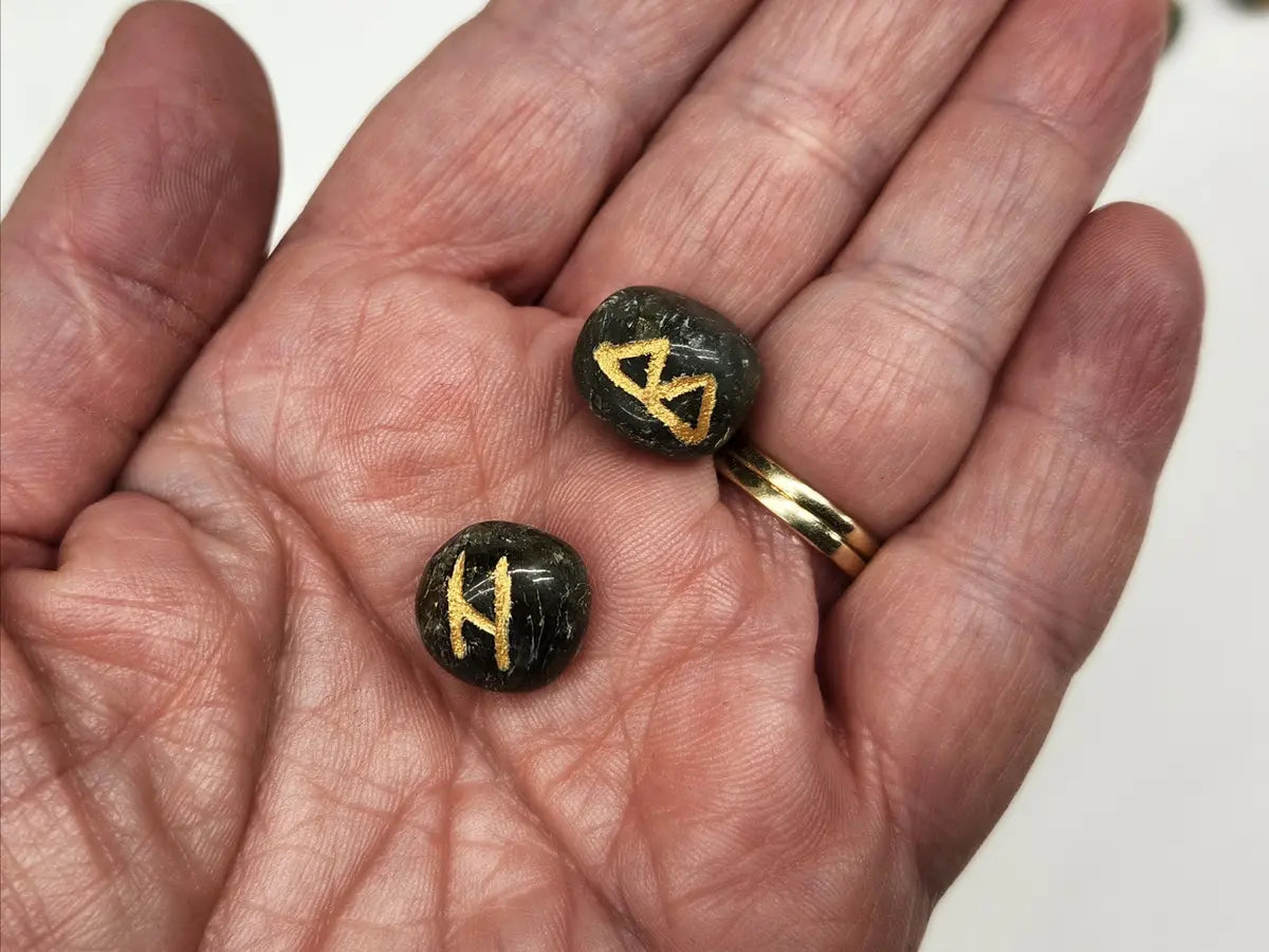 Polished Labradorite rune stones with gold Elder Futhark symbols showing natural color and flash