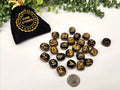 Tiger Eye Elder Futhark rune stone set with gold engraved symbols and black storage pouch