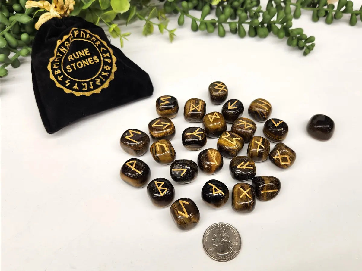 Tiger Eye Elder Futhark rune stone set with gold engraved symbols and black storage pouch