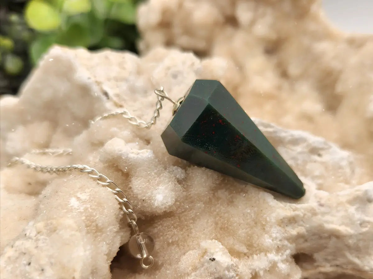 Bloodstone crystal pendulum with silver-plated chain for divination and intuitive practices