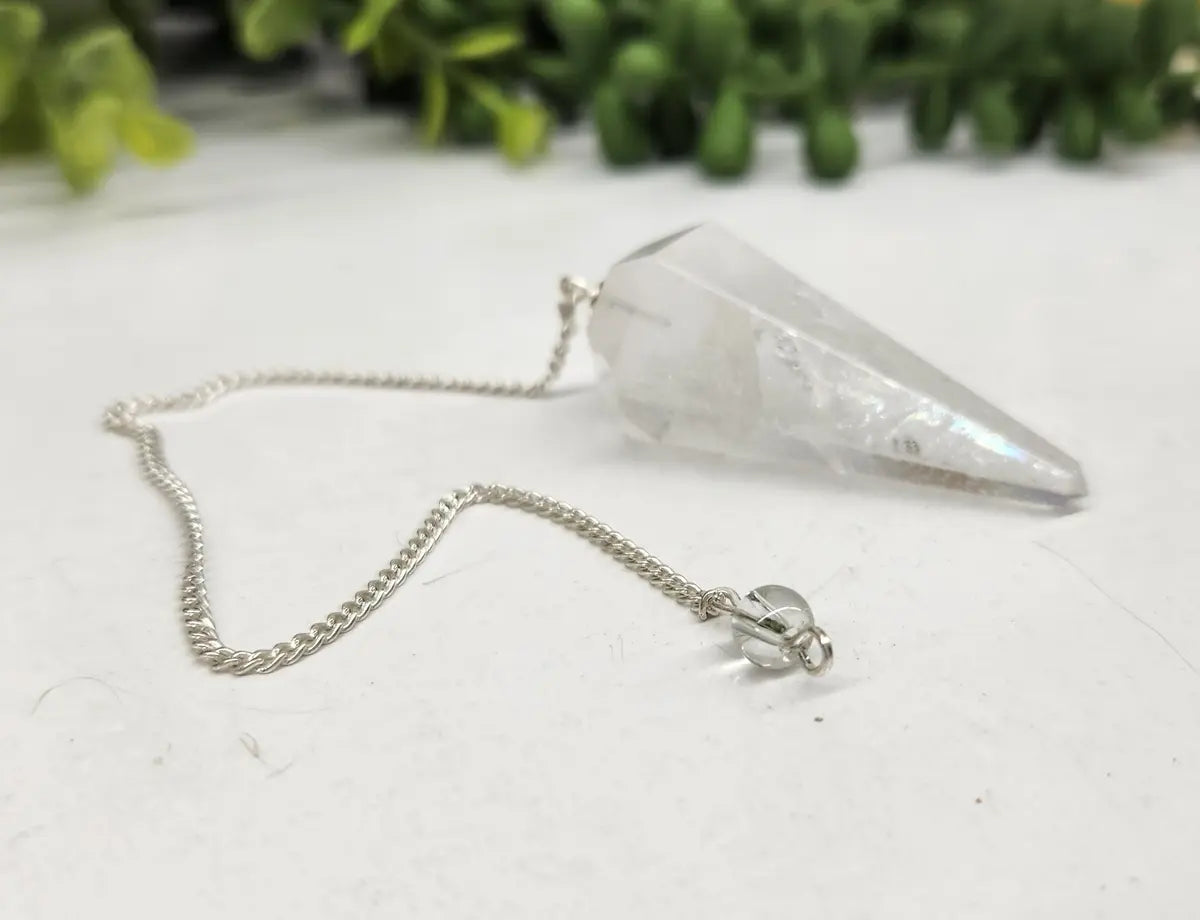Clear Quartz crystal pendulum with silver-plated chain for divination and intuitive practices